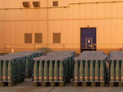 Pallets of 155 mm artillery ammunition in the yard of an armaments factory
