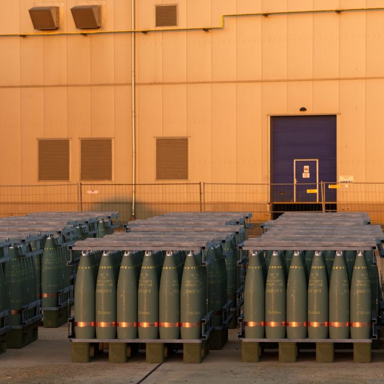 Pallets of 155 mm artillery ammunition in the yard of an armaments factory